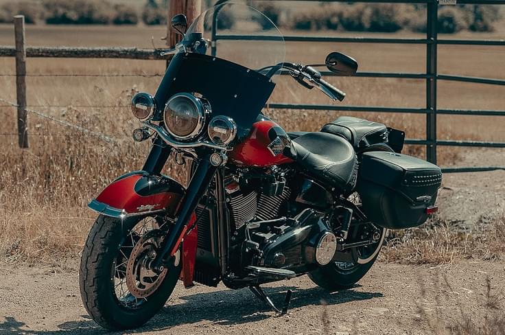 While most bikes have seen a price increase, the Heritage Classic has seen a substantial Rs 3.34 lakh price cut. Harley-Davidson Heritage Classic front left static in field